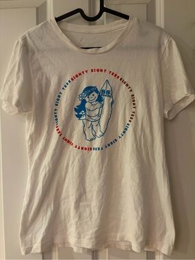 88 tees Graphic Tee with Blue Surf Girl and Red Accent